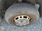 a close up of a flat tire on a truck