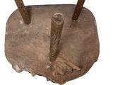 a wooden stand with two sticks sticking out of it