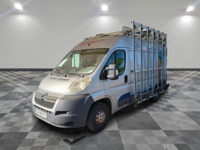 an image of a silver truck parked on a checkered floor