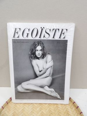 a magazine sitting on top of a table next to a basket