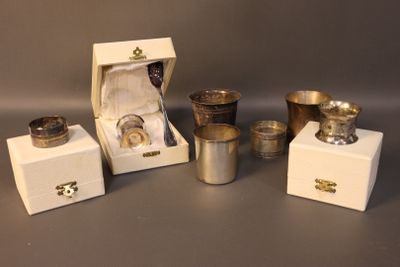 several silver cups and cups are sitting in a box on a table