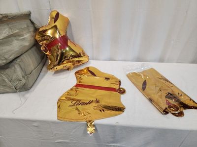 a table with a bunch of gold foil items on it
