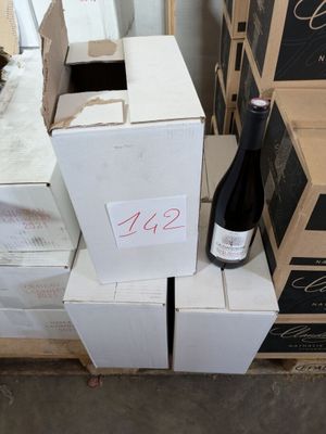 several boxes of wine are stacked on top of each other