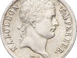 an old silver coin with a crown on top of it
