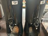 pair of coffee machines sitting on top of a table in a room