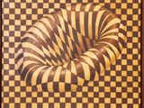 une image représentant une peinture avec un motif en spirale sur une surface à carreaux