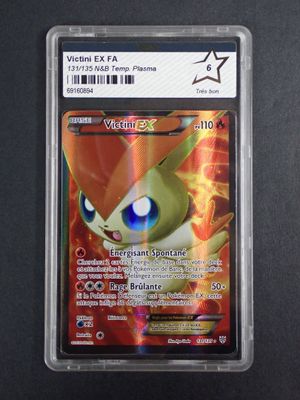 a close up of a card in a plastic holder on a table