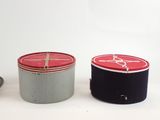 two tins sitting next to each other on a table