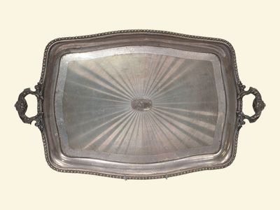 a silver tray with handles on a white background