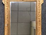 a mirror that is on the wall in the room