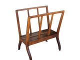 a wooden magazine rack with a magazine holder on it