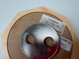 a wooden clock with a metal face on it