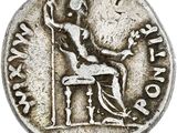 une pièce d'argent sur laquelle figure l'image d'un homme assis sur une chaise