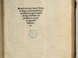 an open book with a stamp on it sitting on a table