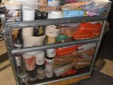 a cart full of food that is sitting on the floor