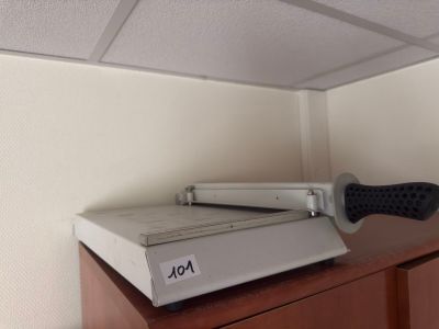 a video game system sitting on top of a wooden cabinet