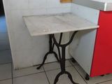 a small table and a sink in a small room
