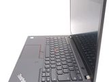 a laptop computer that is open on a white surface