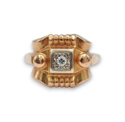 an image of a gold ring with a diamond in the center
