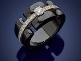 a close up of a ring with diamonds on a blue background