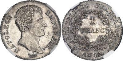 a silver coin with an image of a man on it