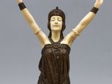 a statue of a woman with her arms outstretched