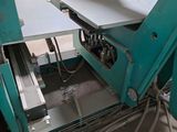 a machine that is working on a piece of metal
