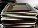 many plates stacked on top of each other on a table