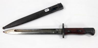 a knife that is laying next to a knife on a table