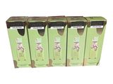 four boxes of green tea sitting on top of a white table