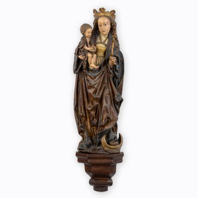a statue of a woman holding a child in her arms