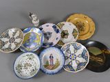 a lot of plates that are sitting on a table