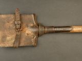 an old, rusty, rusty, and rusted tool on a gray surface