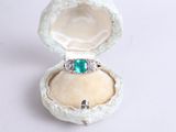 a ring that is sitting in a box on a table