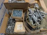 a box of screws and bolts on a table