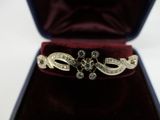 a ring that is in a velvet case on a table