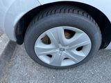 a close up of a car ' s tire on the street