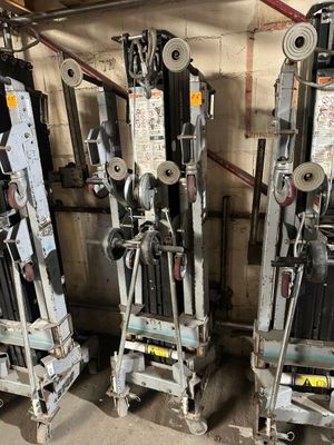 three machines that are sitting next to each other in a room
