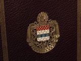 a book with a coat of arms and a crest on it
