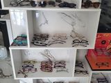 many glasses on the shelves in the room