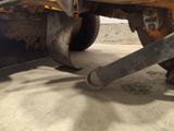 a close up of a truck with a flat tire