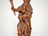 an image of a statue of a man holding a candle