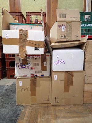 many boxes stacked on top of each other in a room