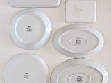 many plates that are sitting on a table