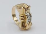 an image of a gold ring with a diamond in the middle