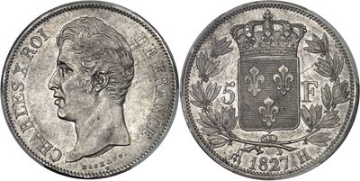 a silver coin with a crown on top of it