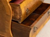 a wooden desk with two drawers on top of it