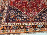 an image of a large oriental rug on a wooden floor