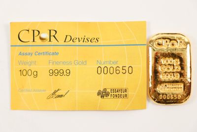 a credit card with a gold bar attached to it