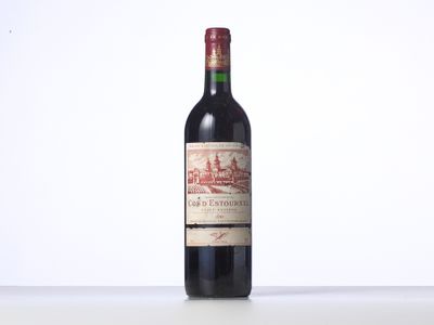bottle of red wine on a white table with a white background